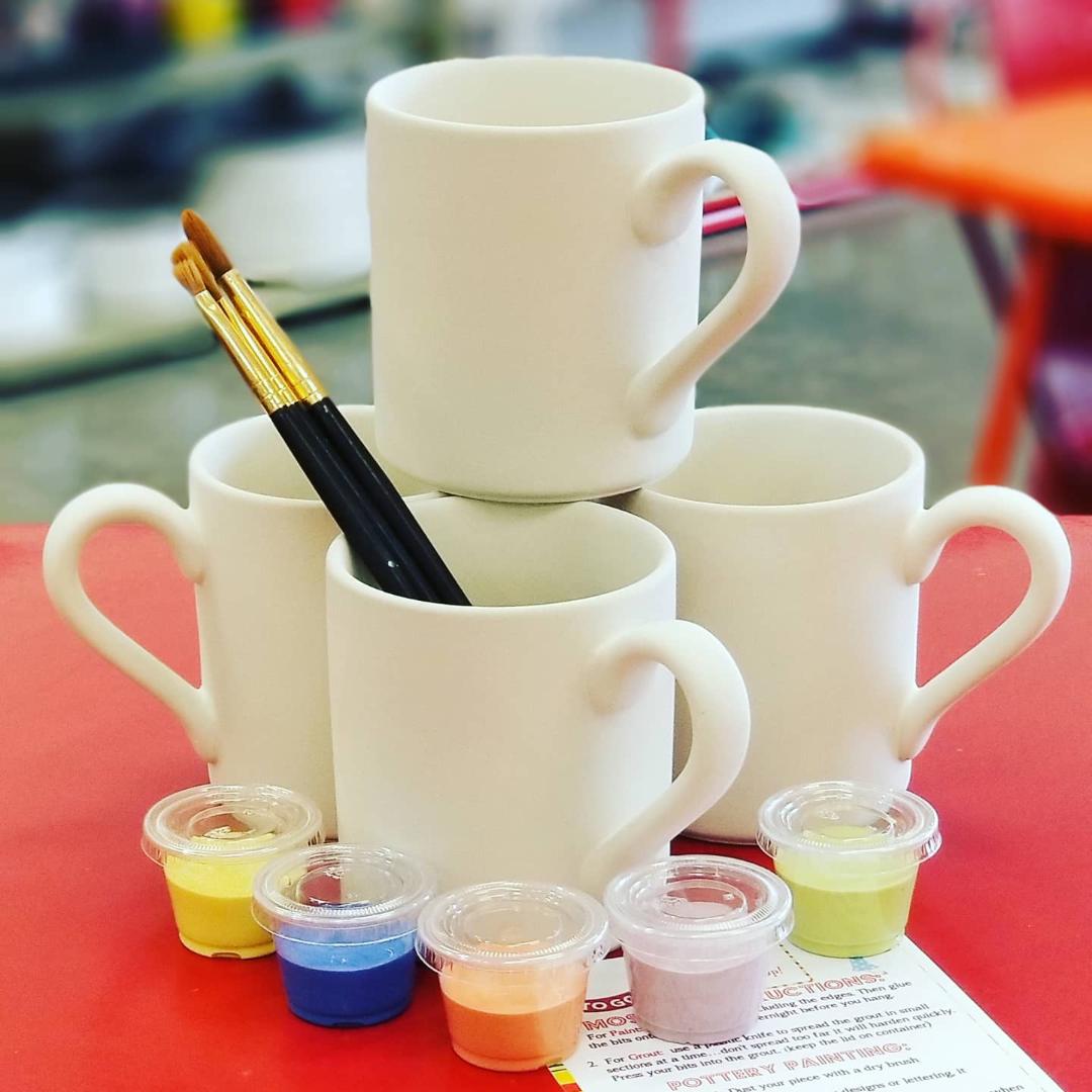 Vibrant pottery painting scene at The Hot Spot Franchise, highlighting enjoyable activities at Painted Pottery Franchise