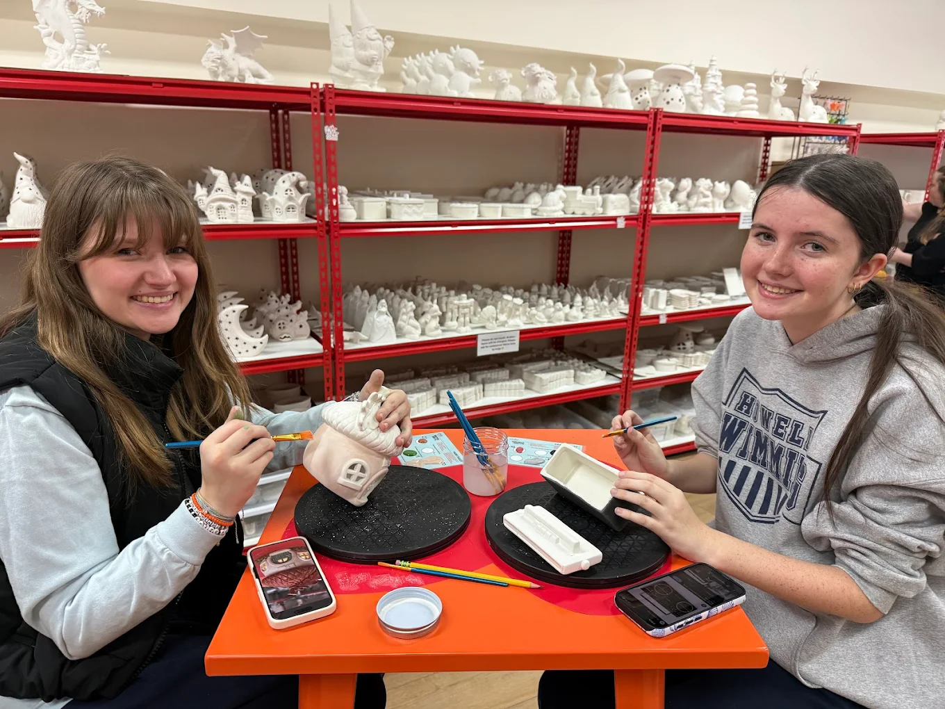 Friends paint pottery at The Hot Spot Studios in Howell NJ